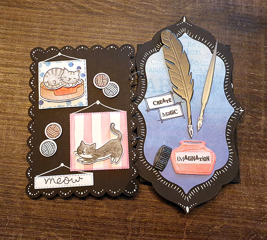 the fourth and fifth card of a set of birthday cards which are bound together like a booklet. The bases of the cards are black. The left one is styled like a gallery, which small pictures of cats hanging from the card. One cat is a tuxedo, the other a grey tabby. The card on the right holds an inkwell with the text imagination as the label. Above it are two quills. To the left a small text reads Create Magic.
